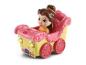 Spielzeugprinzessin in einer rosa-gelben Kutsche mit Blumenmotiven.