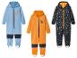 Drei Kinder-Ski-Overalls mit Tiermotiven.