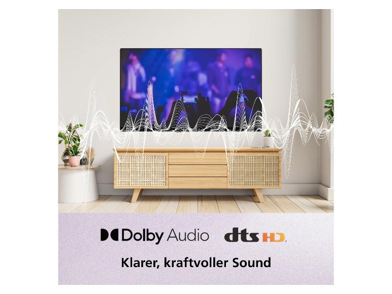 Fernseher zeigt Konzert mit Schallwellen, TV-Schrank, Text: „Klarer, kraftvoller Sound“.