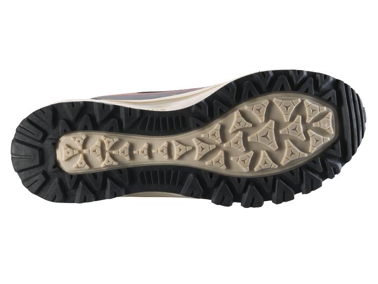 Schwarze und beige Wanderschuhsohle mit robustem Profil.