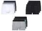 Drei Paar Boxershorts in Schwarz, Grau, Weiß und Grün.
