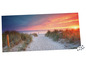 Ein Puzzle mit einem Sonnenuntergang am Strand und einem Weg durch Dünen.