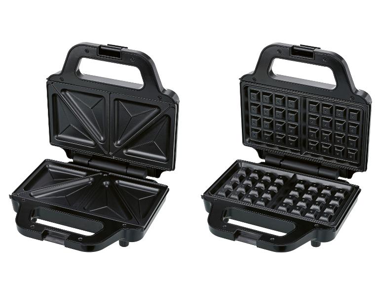 Offener schwarzer Sandwich- und Waffelmaker mit austauschbaren Platten.