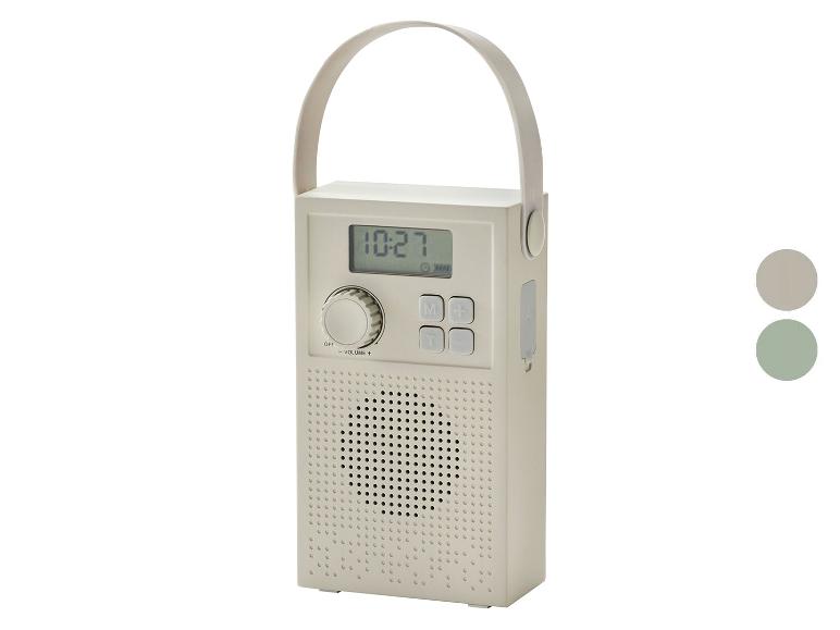 Tragbares Radio mit Digitalanzeige, die 10:27 anzeigt, und Griff, in Beige.