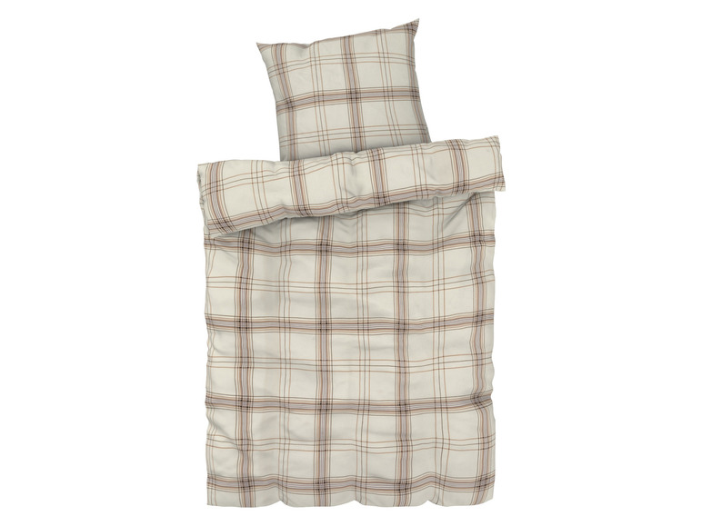 Beige Bettbezug mit passenden Kissenbezügen im Karomuster.