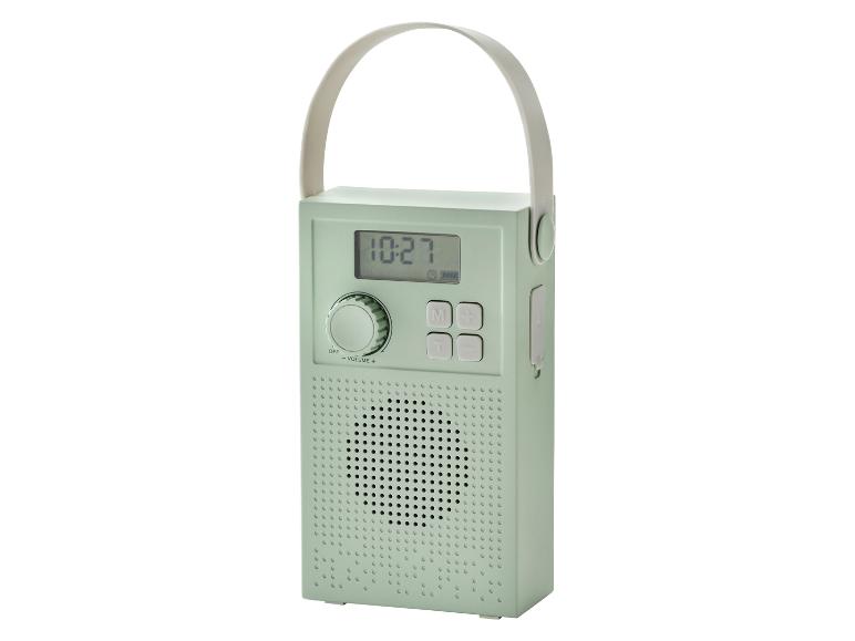 Mintgrünes tragbares Radio mit Digitalanzeige und Tragegriff.