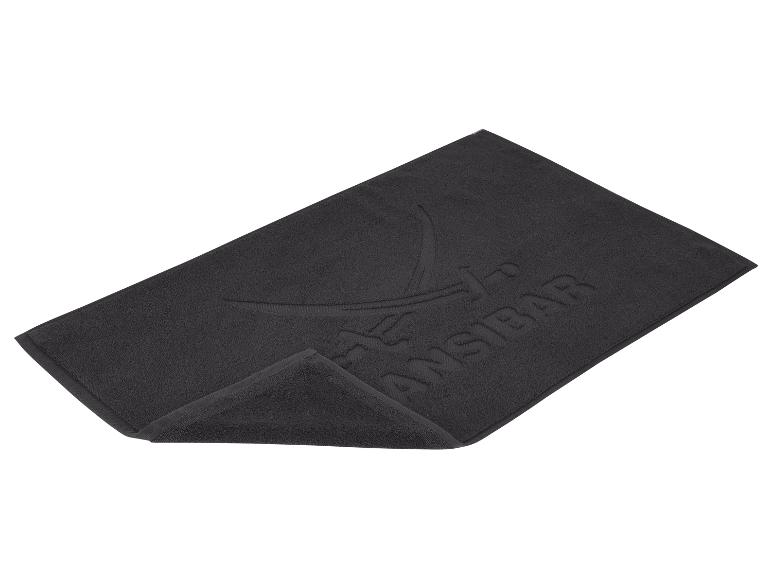 Dunkelgraue Badematte mit geprägtem Logo und „ZANZIBAR“-Schriftzug.