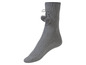 Graue Wollsocken mit Bommeln.