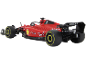 Rotes Spielzeug-Rennauto mit gelben Felgen auf schwarzem Hintergrund.