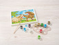 Ein Malen-nach-Zahlen-Set mit Dinosaurier-Motiv, Farbtöpfchen und Pinsel.