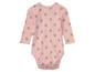Ein rosa Baby-Body mit Blumenmuster.