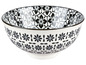 Eine weiße Schüssel mit schwarzen Blumenmustern.