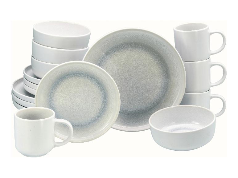 Weißes und graues Keramikgeschirrset mit Tellern, Schalen und Tassen.