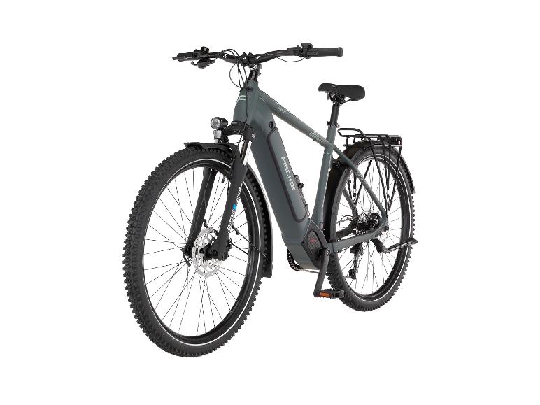 Graues Elektro-Mountainbike mit Stollenreifen und Gepäckträger.