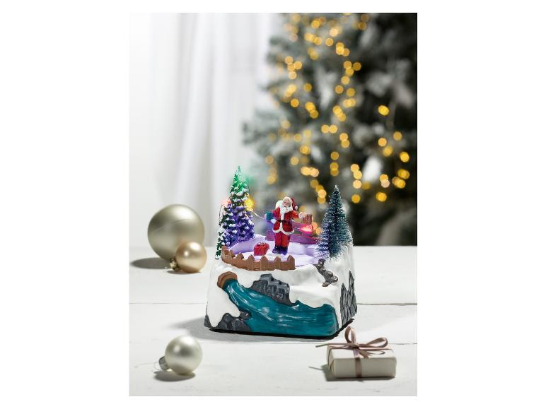 Weihnachtsdekoration mit singenden Weihnachtsmann auf Schlittschuhen.