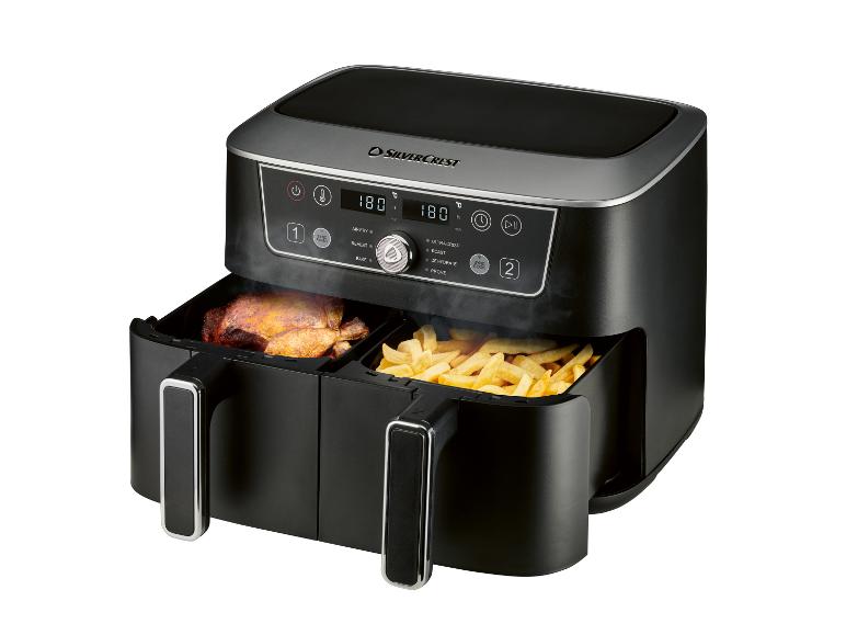 Doppel-Heißluftfritteuse mit Brathähnchen und Pommes Frites, mit digitaler Steuerung.