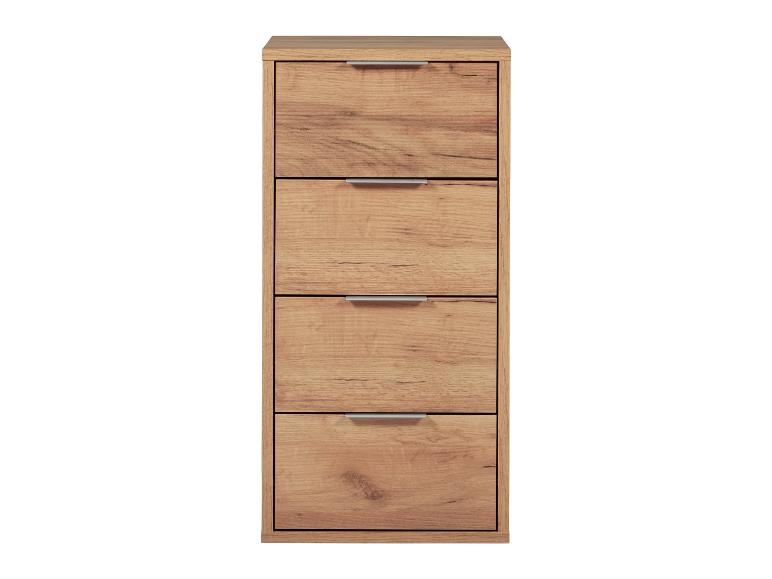 Eine Kommode aus Holz mit vier Schubladen.