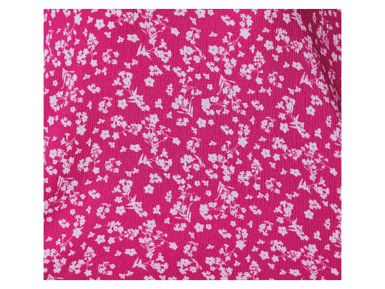 Leuchtender rosa Stoff mit weißem Blumenmuster.