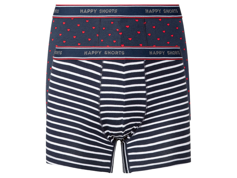 Zwei Paar Happy Shorts Boxershorts, eines mit weißen Streifen und eines mit roten Herzen.