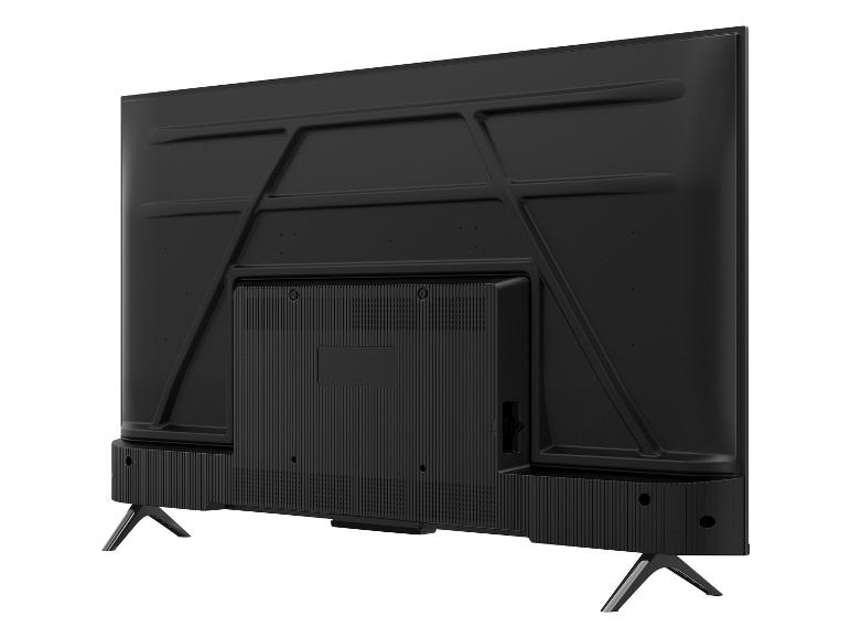 Rückseite eines schwarzen Fernsehers mit Standfüßen, schräg gesehen.