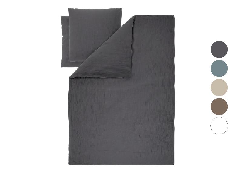 Dunkelgraues Musselin-Bettwäscheset mit Farbpalette.