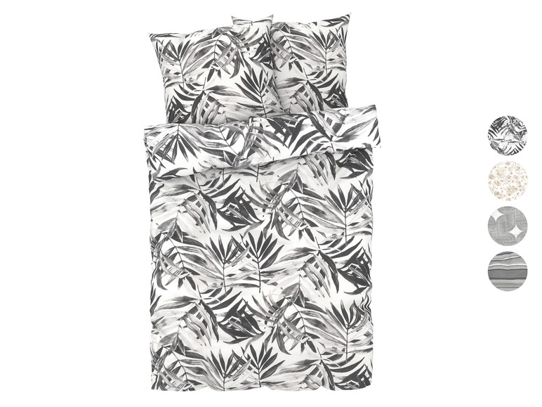Bettwäsche mit schwarz-weißem Palmenblatt-Muster.