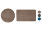 Eine runde und rechteckige Badezimmermatte in Beige.