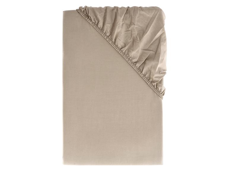 Beige Spannbettlaken aus Baumwolle.