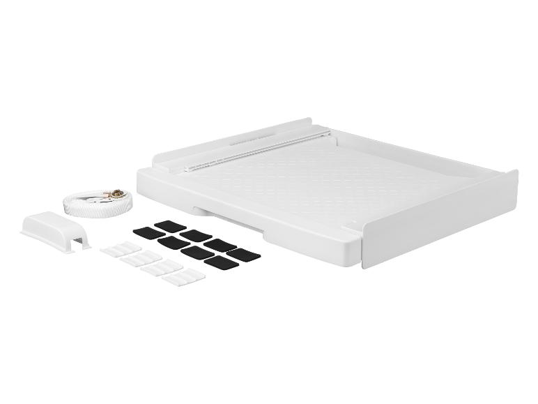 Weiße Waschmaschinenunterlage mit Befestigungsgurt und Antirutschpads.