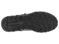Unterseite einer schwarzen Sportschuhsohle mit Muster und TRAXION-Schriftzug