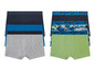 Zwei Sets Boxershorts für Jungen, eine mit unifarben und eine mit Mustern.