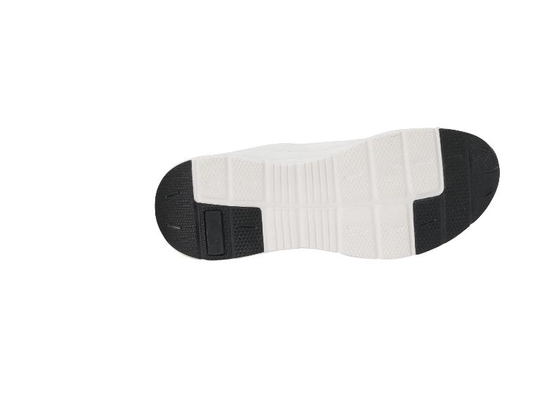 Weiße und schwarze Sportschuhsohle mit Traktionsmuster.
