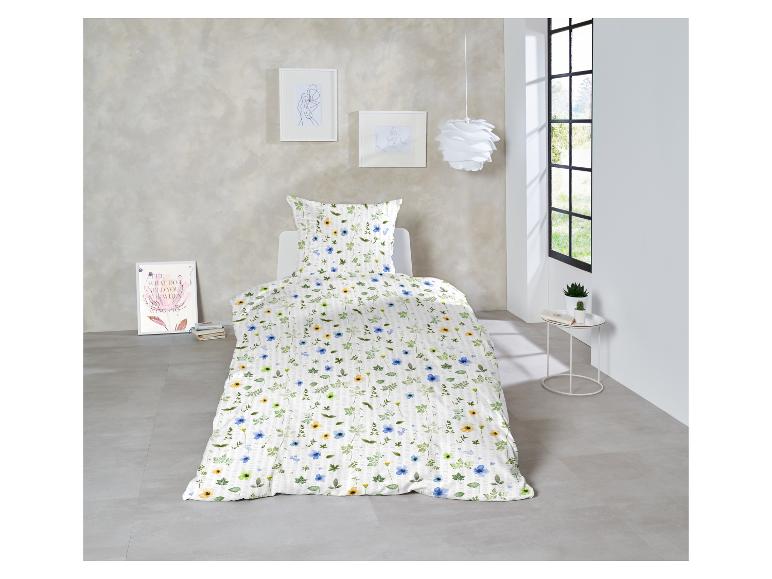 Blumen Bettwäsche: Bettbezug und Kissenbezug mit Blumenmuster.