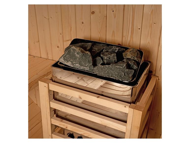 Saunaofen mit Vulkansteinen in einer Holzkabine