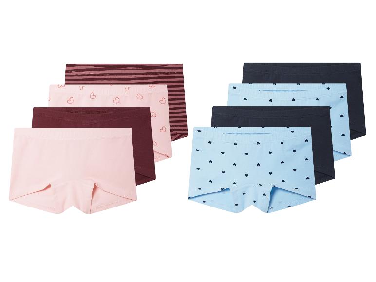 Sechs Mädchen-Unterhosen in verschiedenen Farben und Mustern.