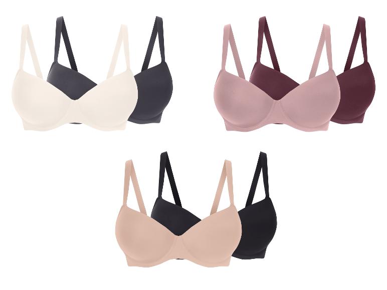 Drei BH-Paare in verschiedenen Farben: Beige und Dunkelgrau, Rosa und Bordeaux, Nude und Schwarz.