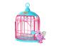 Ein rosa Vogelkäfig von Little Live Pets mit einem lila Vogel daneben.
