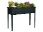 Schwarzes rechteckiges Hochbeet mit einer Auswahl bunter Blumen