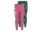 Zwei Kinderleggings, eine rosa mit Zeichentrickfigur und eine grüne mit Blattmuster.