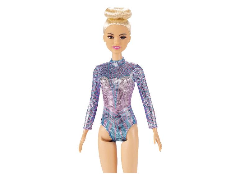 Barbie Puppe in einem glitzernden Turnanzug.