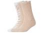 Drei Paar beige und weiße Socken, eines mit Zebramuster.