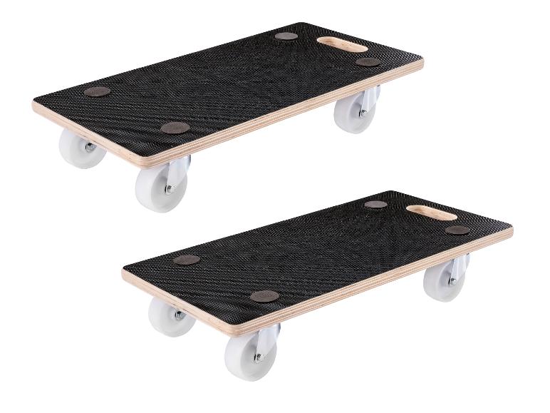 Zwei Möbelroller aus Holz mit schwarzen Antirutschflächen und weißen Rollen.