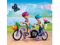 Zwei Spielfiguren fahren ein lila Tandem mit Blumen und einem „Flower Shop“-Schild.