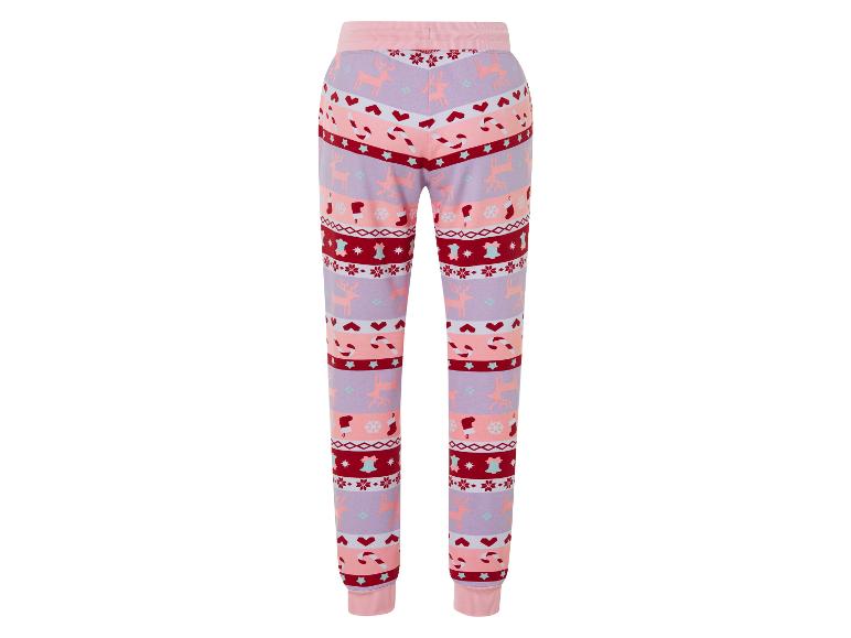 Eine rosa Jogginghose mit einem Weihnachtsmuster mit Rentieren.