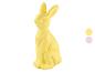 Gelbe Osterhasenfigur mit zwei Farbmustern auf der rechten Seite.