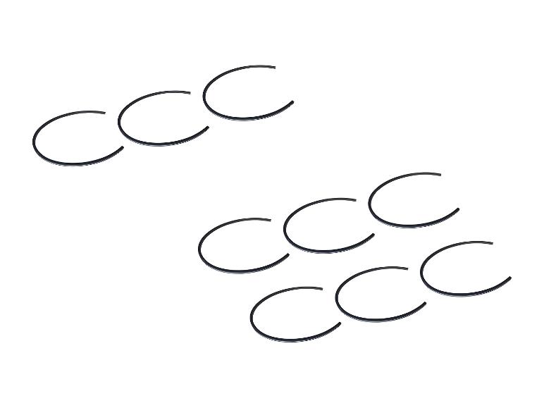 Mehrere schwarze Gummidichtungen in Gruppen auf weißem Hintergrund