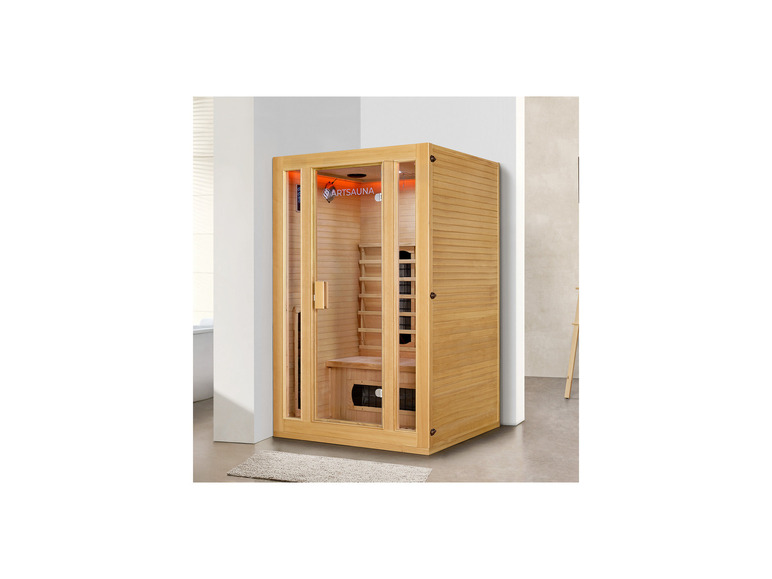 Eine Holzsauna von Artsauna mit Glastür.