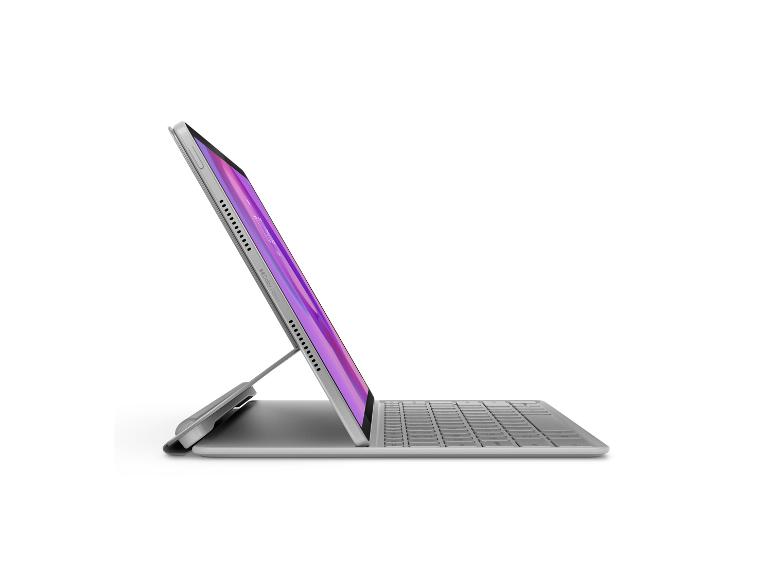 Tablet mit Tastatur und Ständer, Bildschirm mit lila Hintergrund und „Dolby Atmos“-Text.