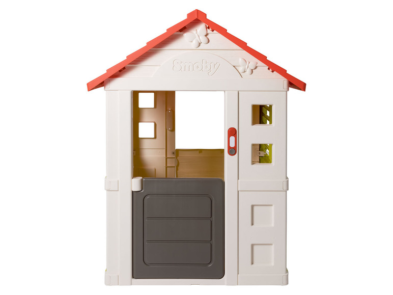 Ein weißes Spielhaus mit rotem Dach von Smoby.