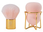 Ein rosa Make-up-Pinsel und ein Schwamm in einem goldenen Ständer.